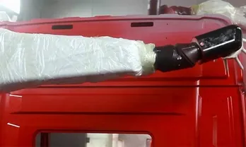 Pulverización asistida por robot de capa base