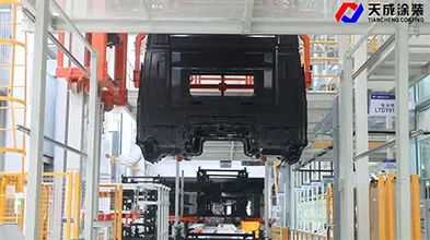 Transferencia automática de cabinas de camiones y secado de adhesivos